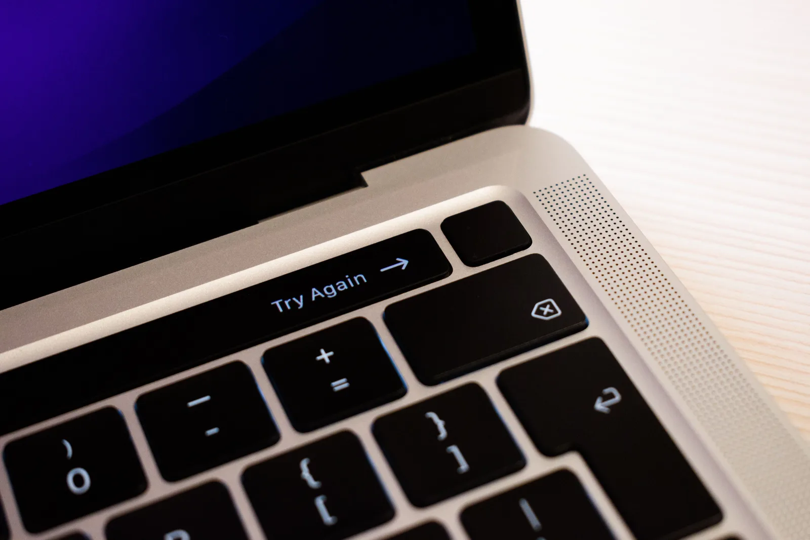 High-resolution close-up of a laptop keyboard featuring a 'Try Again' button. What to check when cloud files are missing or sync is stuck