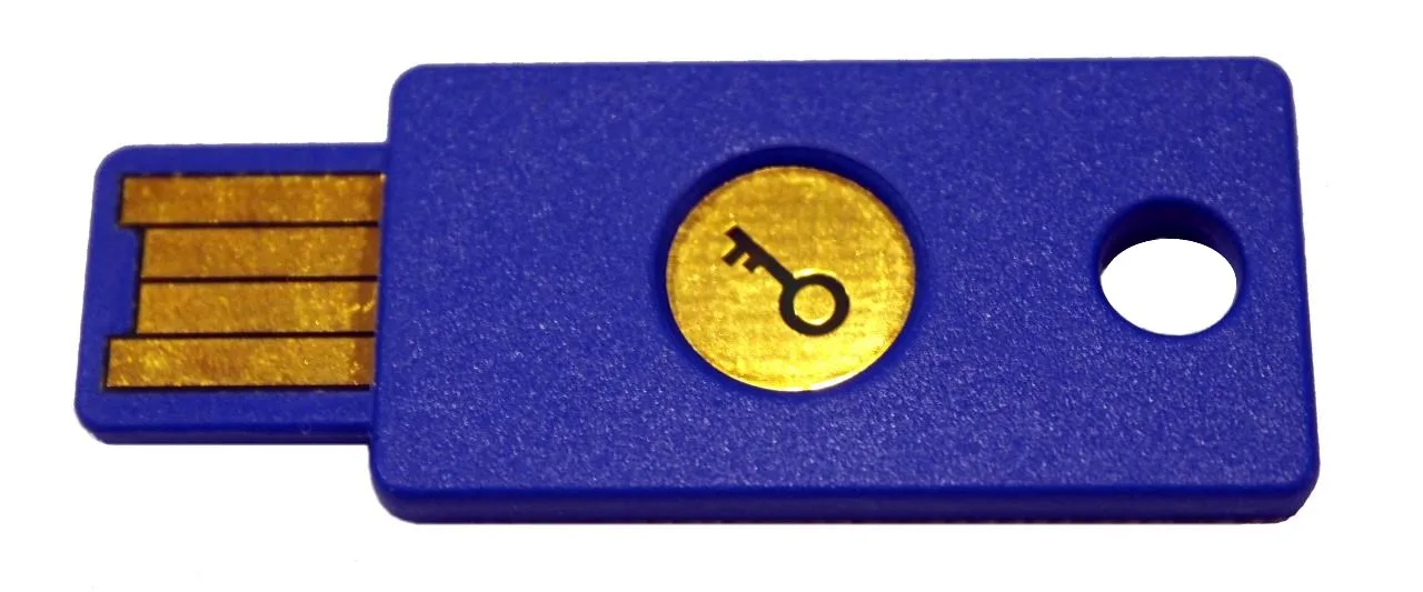 A blue USB security key with a gold key symbol
