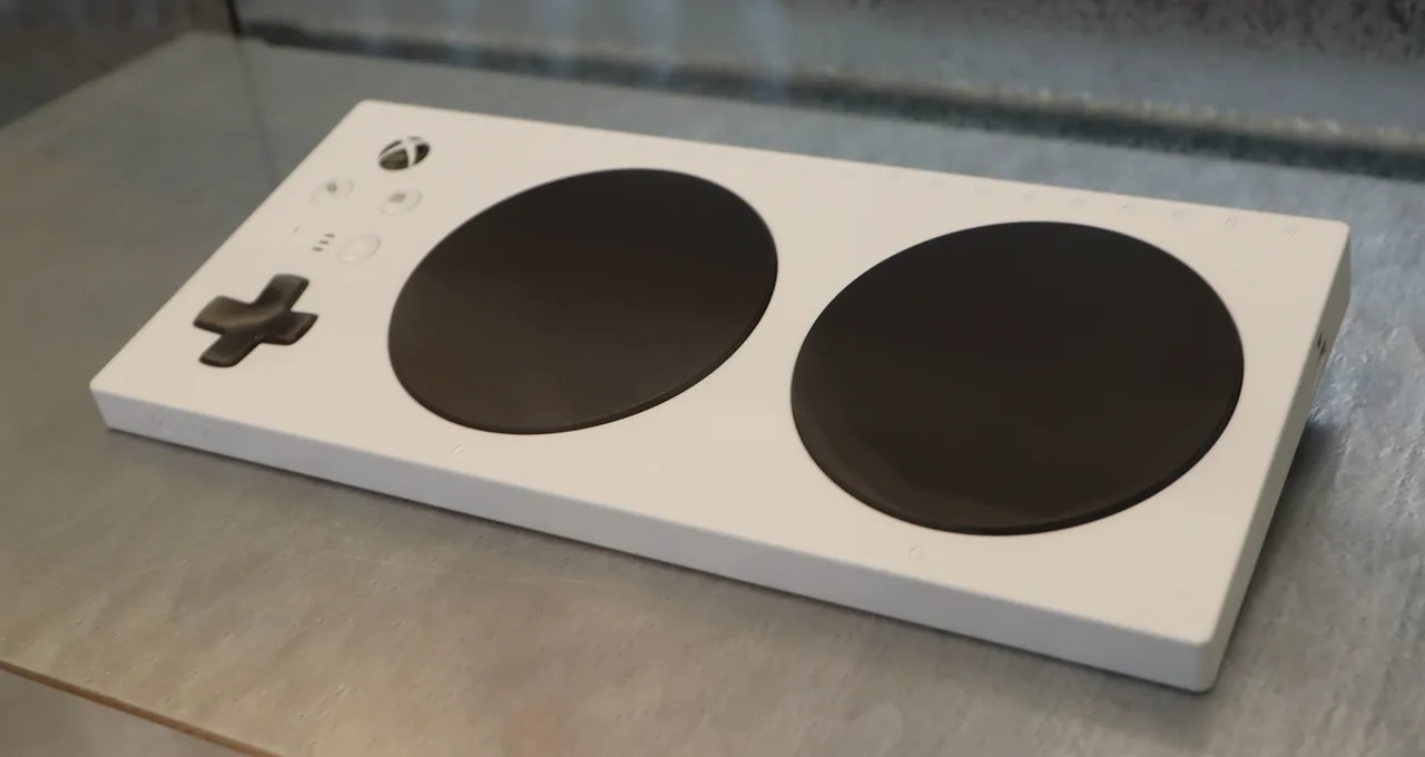 White adaptive game controller with two large black buttons